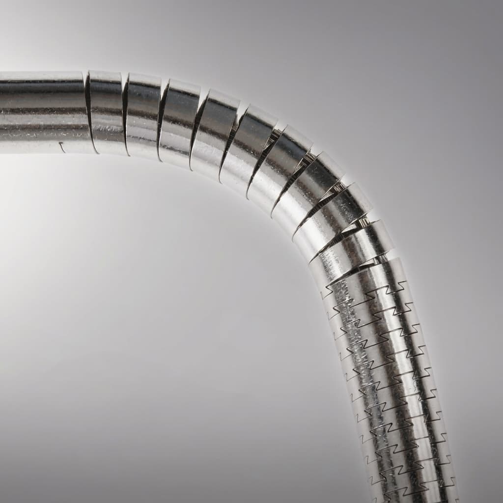 Precision laser-cut stainless steel snake-bone hypotube with interlocking hinge and spiral transition pattern
